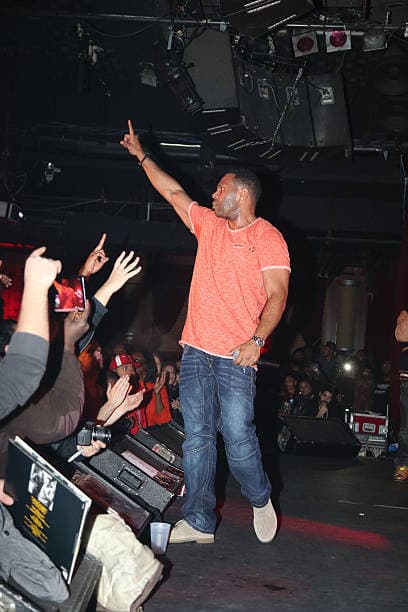C.L. Smooth on stage, reaching out to the crowd.