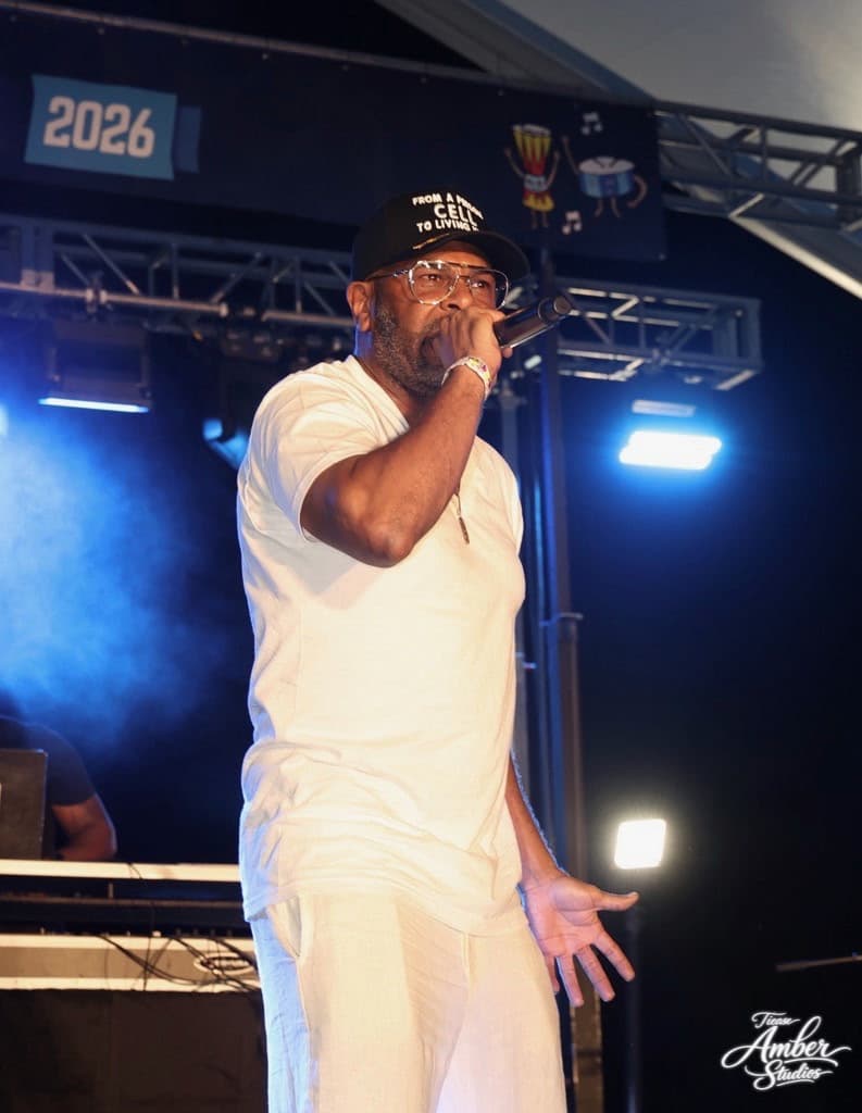 C.L. Smooth performing at SummerStage 2026, mid-verse on the mic.